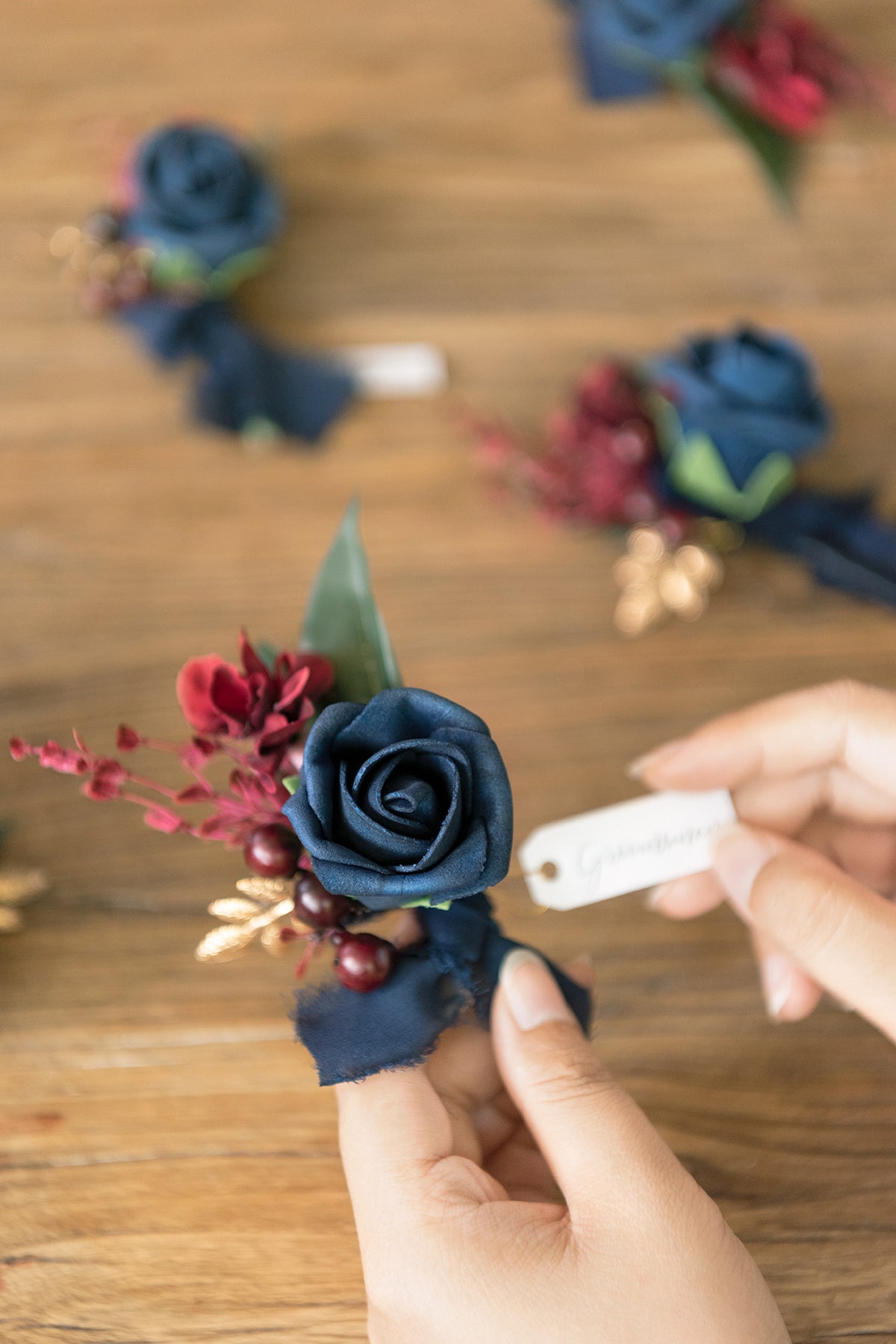 Boutonnieres in Burgundy & Navy