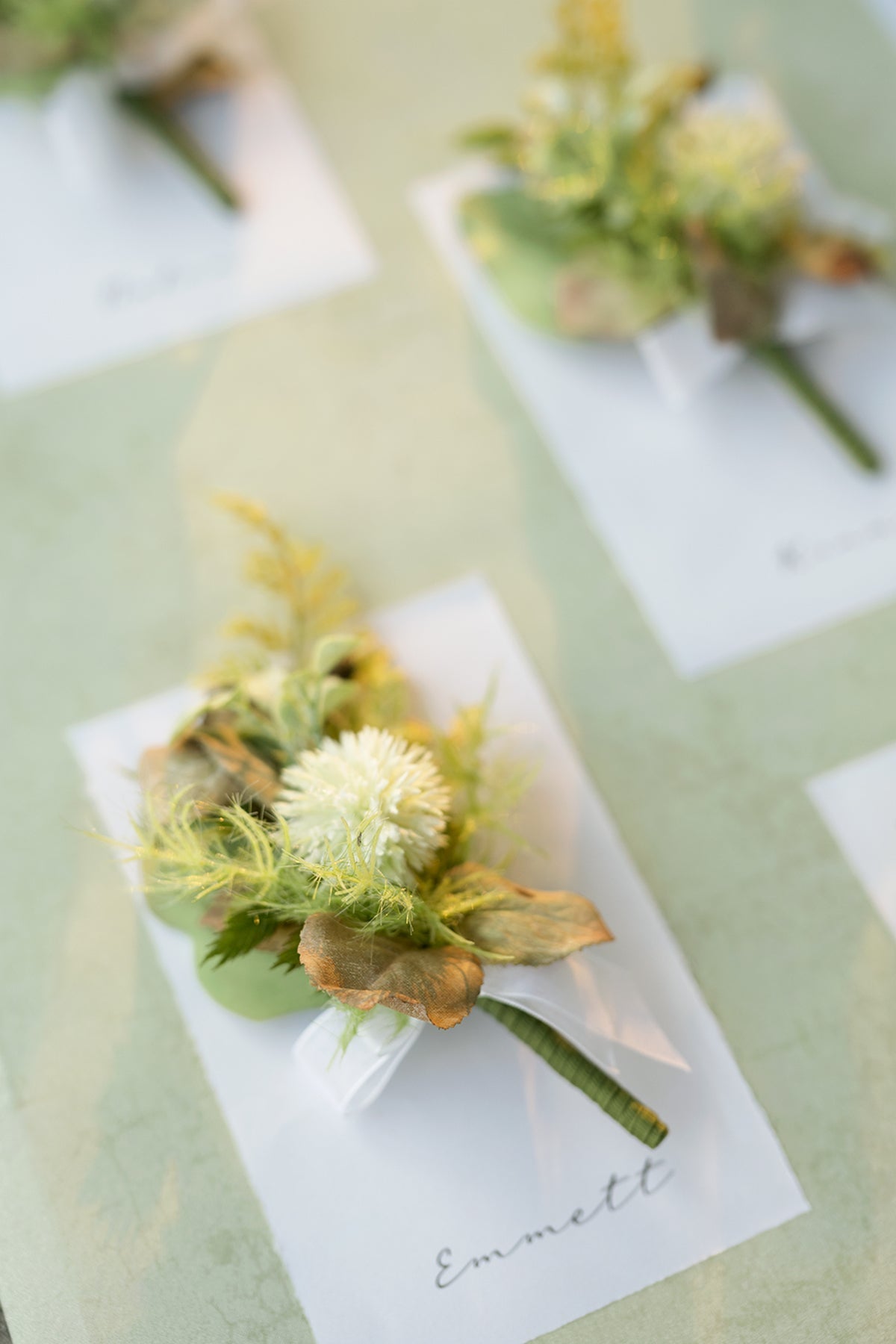 Boutonnieres in Emerald & Tawny Beige