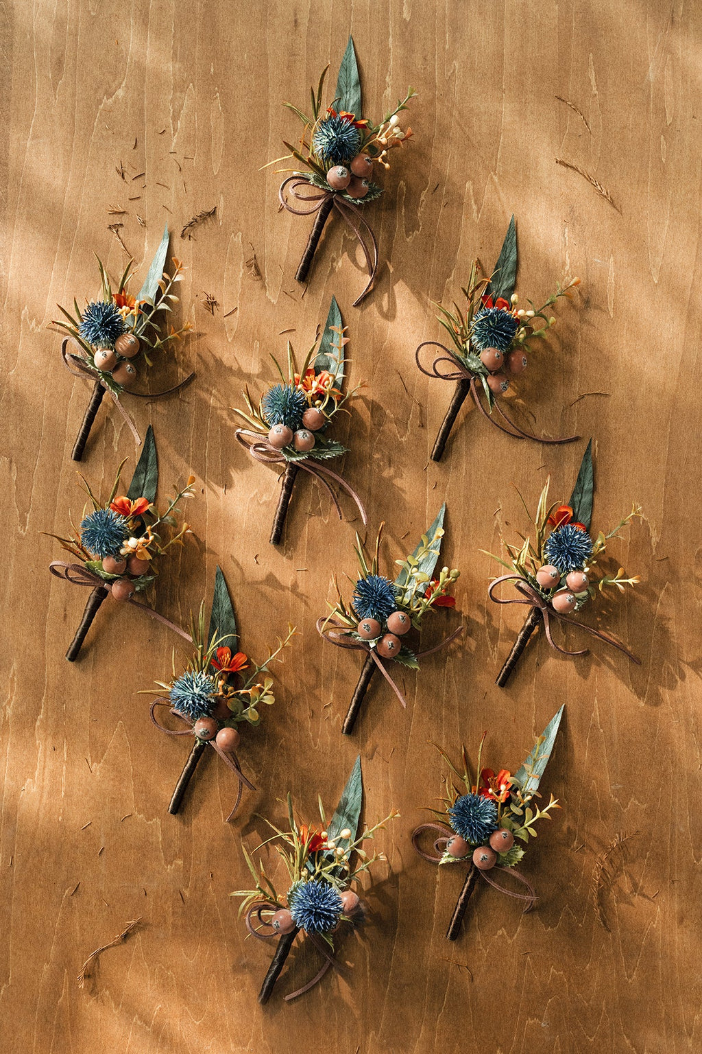 Boutonnieres for Guests in Dark Teal & Burnt Orange